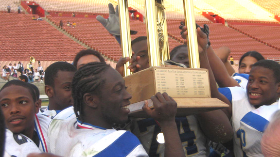 Crenshaw of Los Angeles players hoist CIF L.A. City Section title trophy in 2009. The Cougars didn't have to play Servite of Anaheim in a regional bowl game because that round of games didn't exist at the time. They instead were chosen to play De La Salle of Concord in the CIF Open Division state bowl game.