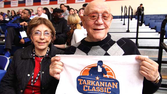 College basketball coaching icon Jerry Tarkanian shows off a commemorative towel with a logo that shows him biting one as he did every game on the bench. Tarkanian witnessed Mater Dei's victories over Bishop Gorman (La Vegas) and Morgan Park (Chicago). Photo by Nick Koza