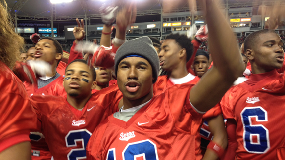 Senior running back Marques Rodgers, who scored Serra's first three touchdowns, sings the school song after the Cavaliers won CIF Division II state title on Saturday with victory over Oakdale.