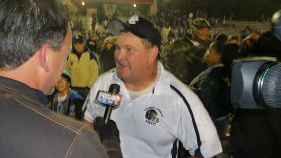 Central Catholic of Modesto head coach Roger Canepa talks to the media after his team's win over McClymonds of Oakland in the CIF Division IV Northern California regional bowl game.