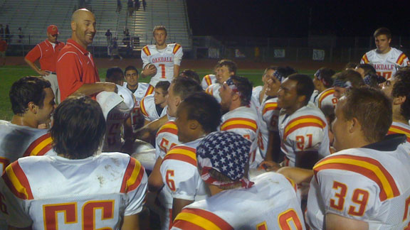 Oakdale coach Trent Merzon talks to his team after one of its 13 victories this season. Mustangs won CIF Sac-Joaquin Section D3 title on Friday night over Vista del Lago.