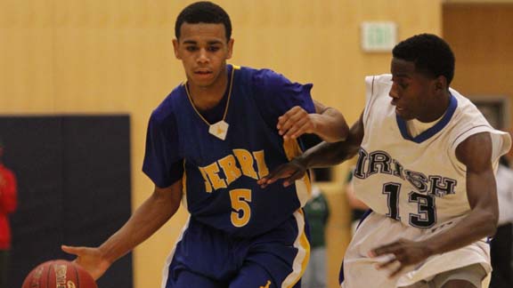 San Mateo Serra point guard Andre Miller dribbles up the court from a game last season. Photo: Willie Eashman.