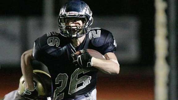 Jake Taylor from Rim of the World (Lake Arrowhead) broke a lot of tackles en route to piling up 4,036 yards and scoring 57 touchdowns. He became just the second player in state history with more than 4,000 yards, including five straight outings of 300 or more. He was considered runner-up to Marin Catholic's Jared Goff for small schools state player of the year. Photo by Tina Lingenfelter.