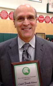 Frank Allocco received a plaque on the occasion of reaching 600 career wins, most which have come at De La Salle of Concord. Photo: Harold Abend.