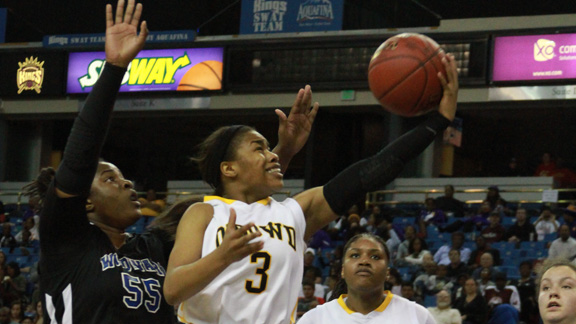 Ariell Bostick of Bishop O'Dowd beats Kristen Simon of Windward on a drive to the basket during CIF Open Division final Saturday in Sacramento. Bostick led the Dragons with 17 points in 60-45 win. Photo: Willie Eashman.