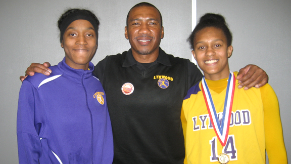 Lynwood seniors Amber Blockmon (left) and Alize Lofton (right) both gained selection to the Division II all-state teams. Lynwood coach Ellis Barfield (center) has had many all-state players over the years, including two who were Ms. Basketball State Players of the Year. Photo: Ronnie Flores. width=