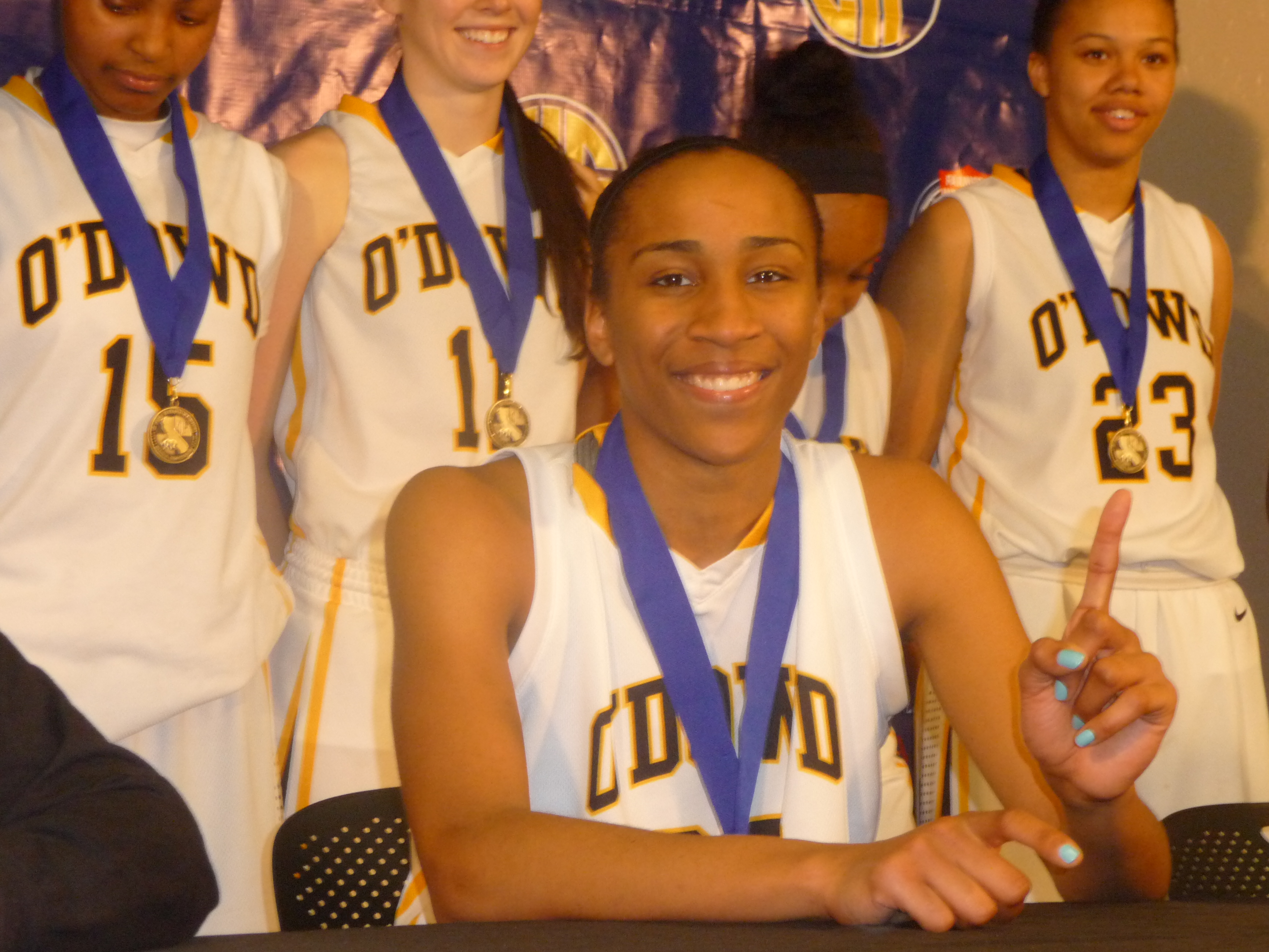 Duke-bound Oderah Chidom signals where she hopes her Bishop O'Dowd girls team will be ranked in the state when the final overall rankings are released next week after Saturday's Open Division state final.
