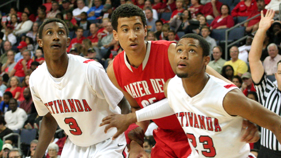 Mater Dei of Santa Ana has gotten big minutes in many games from freshman M.J. Cage, who battles Etiwanda's Sheldon Balckwell (3) and Kenny Barnes (23) during SoCal Open Division final. Photo: Andrew Drennen.