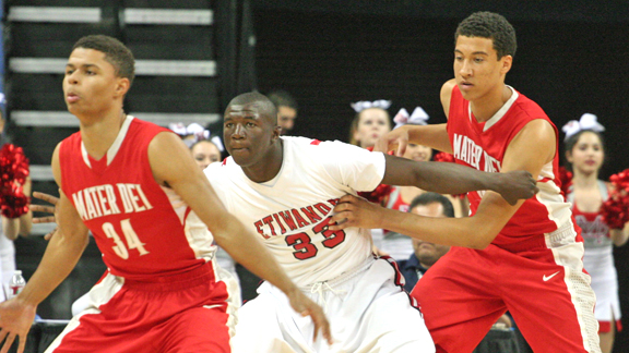 Mater Dei of Santa Ana players attempt to keep Etiwanda's Tim Myles from getting good position during the CIF Southern California Open Division regional final won by the Monarchs. Photo by Andrew Drennen.