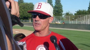 Buchanan head coach Tom Donald is surrounded by media after 2011 title game win. Photo: Mark Tennis.