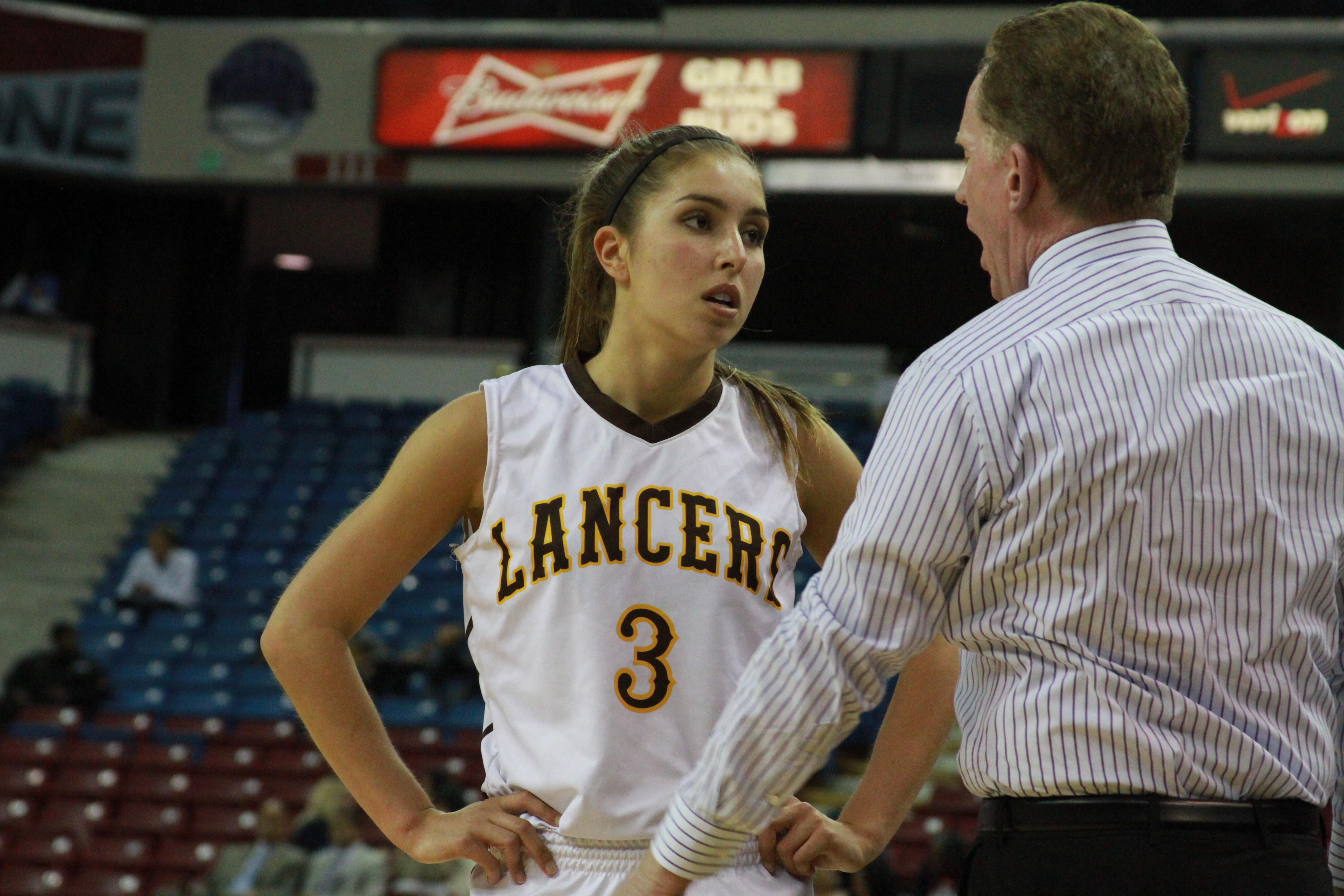 Senior guard Shelbi Aimonetti from St. Francis of Mountain View speaks with head coach Brian Harrigan during CIF Division II state championship against Lynwood. Photo: Willie Eashman.