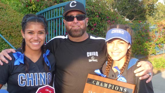 State Softball Coach of the Year Mike Smith of Chino poses for a photo with two of his players after team won second straight CIFSS Division II title. Photo: Mark Tennis.