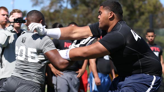 Bellflower St. John Bosco behemoth Damien Mama shows his form during Nike Football event earlier this year. He'll start the season No. 1 in the state at his position. Photo: Tom Hauck (Courtesy Student Sports).