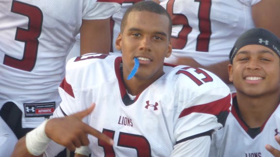 Quarterback Brandon Dawkins of new No. 11 Oaks Christian hams it up for cameras (with teammate Andre Chevalier Jr. on his right) after team defeated Upland. Photo: Mark Tennis.