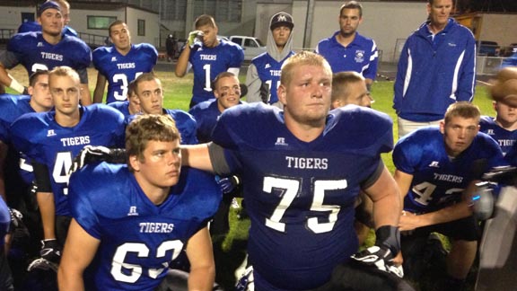 Jacob Hicks (75) and teammates at Analy of Sebastopol listen to coaches after team won last week over Pittsburg. It looks like the boys are just getting warmed up. Photo: Harold Abend.