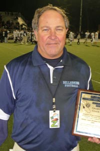 Bellarmine Prep head coach Mike Janda poses with one of the three CCS Open Division titles his teams won from 2008-2011.