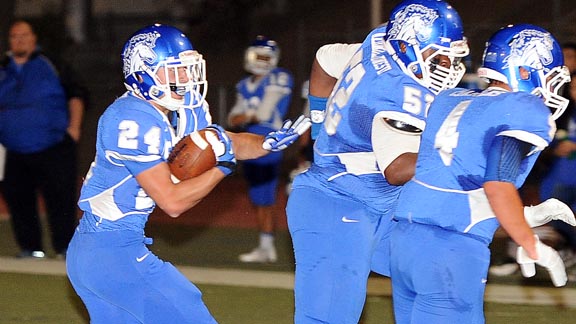 Gilroy senior running back Brandon Boyd follows a convoy of blockers in last week's game vs. Gonzales. Photo: Lora Schraft/Gilroy Dispatch.