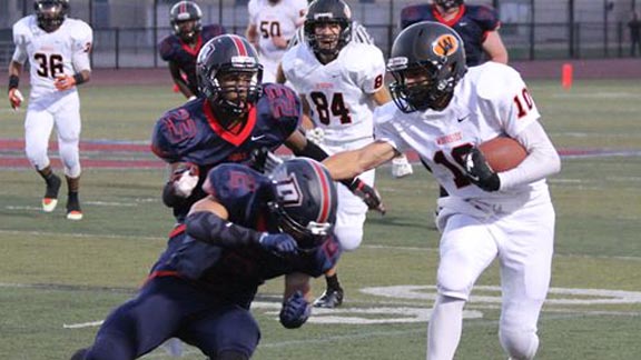 Josh Holman of Woodside tries to break loose on a kick return earlier this season against Dublin. He had three KO return TDs in one game last week. Photo: Woodside High School.