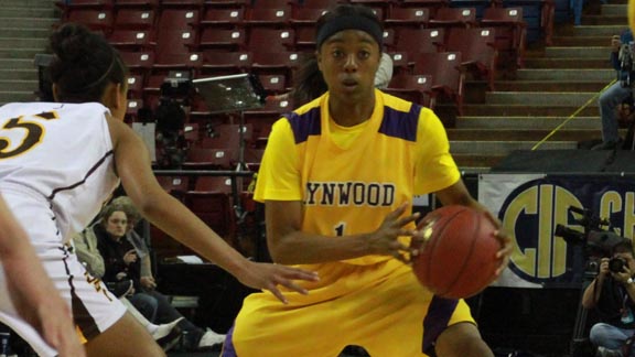 Guard Jazmine Johnson from Lynwood looks for teammates cutting to basket during last year's CIF Division II state championship won by her team. Photo: Willie Eashman.