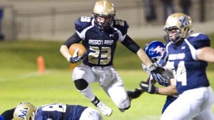 Patrick Laird of Mission Prep leaps through a hole during game vs. Immanuel of Reedley. Photo: Ian Billings Photography (courtesy of school).