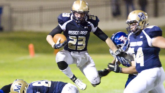 SoCal Player of the Week Patrick Laird of Mission Prep leaps through a hole during game vs. Immanuel of Reedley. Photo: Ian Billings Photography (courtesy of school).