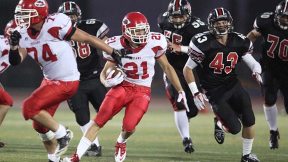 Zander Anding from Burroughs of Burbank churns out some of the 2,464 yards he rushed for during the nine games he played in the 2011 regular season. Photo: Courtesy school.