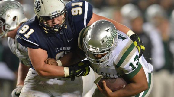 Ivan Martinez of No. 1 St. John Bosco makes a tackle of QB Chris Williams of No. 2 De La Salle in CIF Open Division state bowl game. Photo: Scott Kurtz.