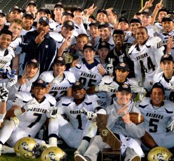 Central Catholic players celebrate second straight title. Player on bottom holding ball is injured player Matt Ringer. Photo: Scott Kurtz.