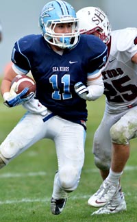 Cole Martin of Corona del Mar is about to get tackled by Sacred Heart Prep's Ben Burr-Kirven. Both players played well in Saturday's game. Photo: Scott Kurtz.