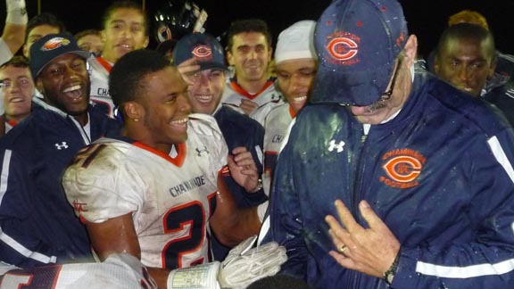 Chaminade running back Donovan Lee (21) has just dumped a bucket onto the jacket of head coach Ed Croson after the team's upset win over Gardena Serra. Photo: Mark Tennis.