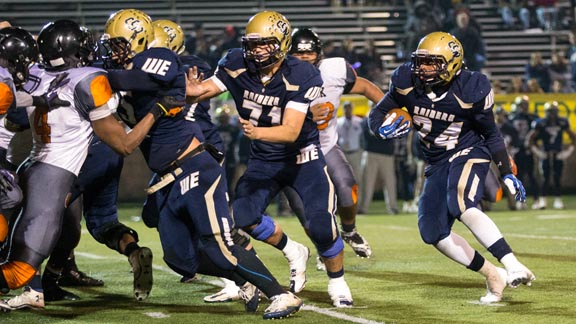 Reggie Bland from two-time CIF D4 state champ Central Catholic looks for running room in D4 NorCal bowl game against McClymonds. Photo: Everett Bass/Bass Photo.