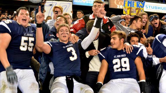 Players from St. John Bosco joining their fans in a post-game celebration include Matthew Katnik (55), Josh Rosen (3) and Gavin Windes (29). Windes made the play that stopped De La Salle's last drive that could have won the game for the Spartans. Photo: Scott Kurtz.
