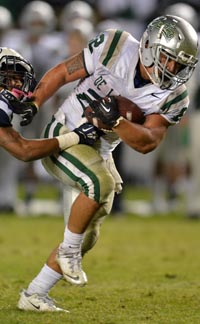 De La Salle running back John Velasco tries to break free of St. John Bosco defender. Photo: Scott Kurtz.