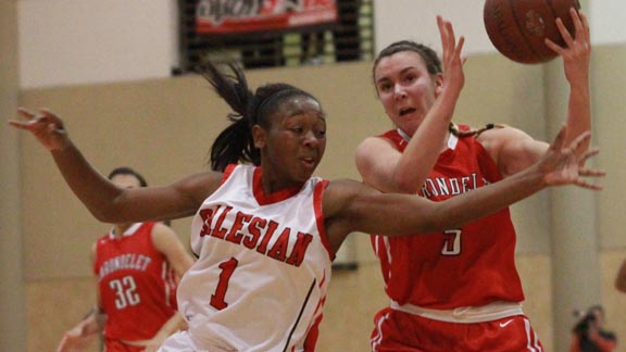 Kian McNair from Salesian of Richmond tries for the steal against Carondelet's Natalie Romeo in the third-place game of the West Coast Jamboree last week. Photo: Willie Eashman.