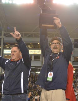 Ed Croson holds up CIF Division II state bowl title trophy at the StubHub Center in Carson. Photo: Scott Kurtz.