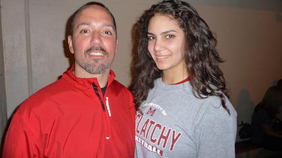 Arena football quarterback legend Aaron Garcia stands with his daughter, Gigi, a sophomore and one of the leading scorers for new D1 state-ranked team at McClatchy of Sacramento. Photo: Mark Tennis.