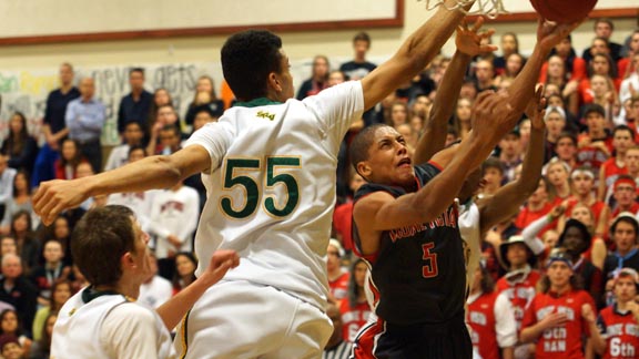 Intensity is the norm when rivals Monte Vista and San Ramon Valley meet, such as above when Monte Vista's Grant Jackson attacks the rim with SRV's Gregg Polosky trying to stop him. Photo: Phillip Walton/SportStars.