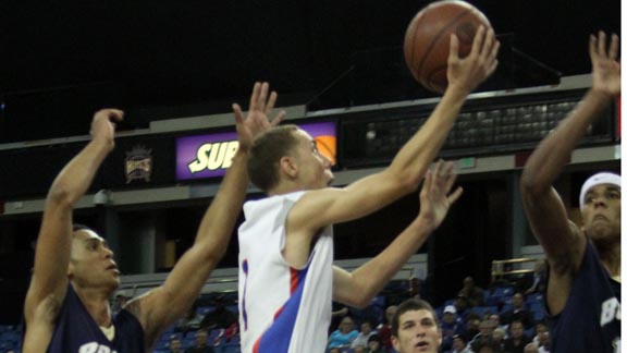 Jordan Ford of Folsom looks for the layup among the out-stretched arms of St. John Bosco defenders during CIF D2 state final. Photo: Willie Eashman.