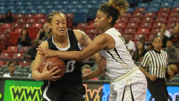 Senior guard Brittany Butler from McNair of Stockton tries to escape tough defense of Mitty's Jahnay Anderson during Saturday's CIF NorCal D2 final in Sacramento. Photo: Willie Eashman.