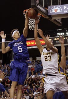 D.J. Wilson of Capital Christian blocks reverse layup attempt by Bishop O'Dowd's Ivan Rabb. Photo: Willie Eashman.