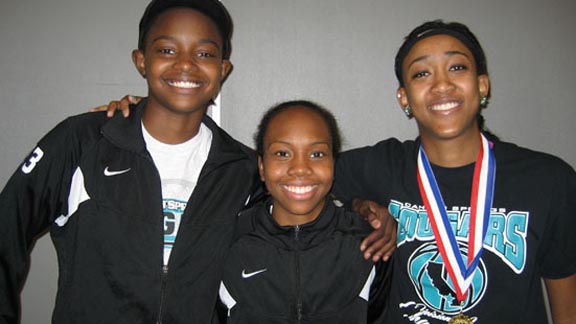 It's all smiles for three key players from Canyon Springs' Division I regional championship team -- junior center Charnea Johnson Chapman, sophomore guard Kimari Hollis and senior forward Cheyenne Greathouse. The Cougars will play next Friday in Sacramento. Photo: Ronnie Flores.
