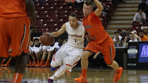 Sophomore point guard Jordan Ford of Folsom attacks the paint with Cosumnes Oaks' Matt Muldavin guarding during CIF NorCal D2 final on Saturday in Sacramento. Photo: Willie Eashman.