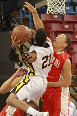 La'vette Parker of Mater Dei applies some tough defense on shot attempt by Bishop O'Dowd's Juwan Anderson. Photo: Willie Eashman.