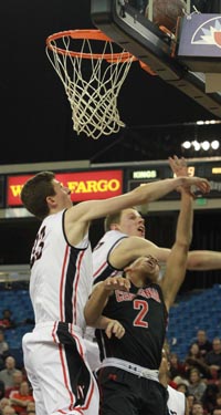 Sedrick Barefield of Centennial gets clobbered on this play by the Monte Vista defense. The Mustangs ended up not allowing a team to score more than 60 points all season. Photo: Willie Eashman.