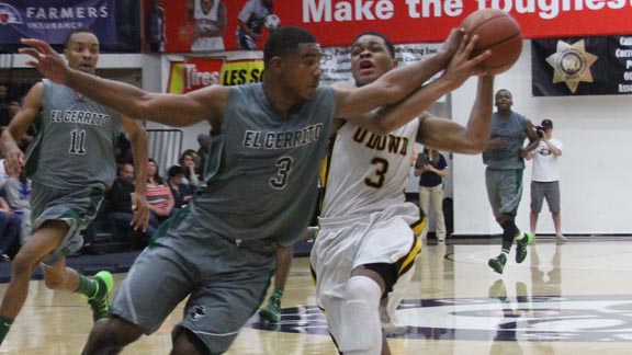 Paris Austin from No. 2 Bishop O'Dowd of Oakland tries to avoid steal attempt by El Cerrito's Tyrell Alcorn in last Saturday's CIF North Coast Section Division III championship. Photo: Willie Eashman.