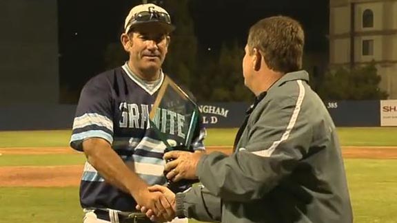 State Coach of the Year James Davis of Granite Hills accepts CIF San Diego Section Open Division title trophy from commissioner Jerry Schneipp. Photo: Courtesy East County Sports.