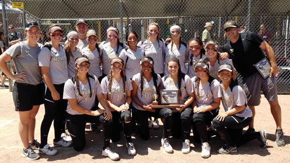 Head coach Brian Yocke leans into a photo pose with the 2014 CCS D2 champions from Archbishop Mitty of San Jose. Photo: Harold Abend.