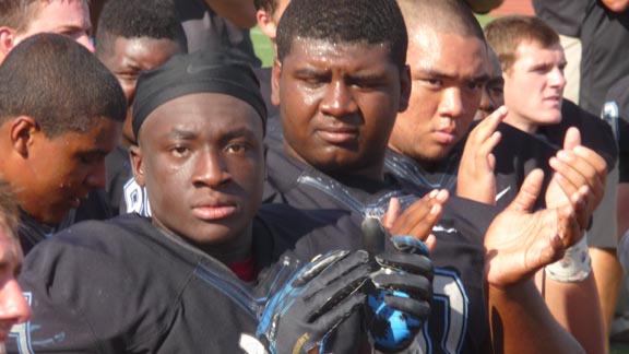 Running back Bolu Olurunfunmi of No. 17 Clovis North shows some intensity during post-game awards ceremony on Saturday in Loomis. Photo: Mark Tennis.