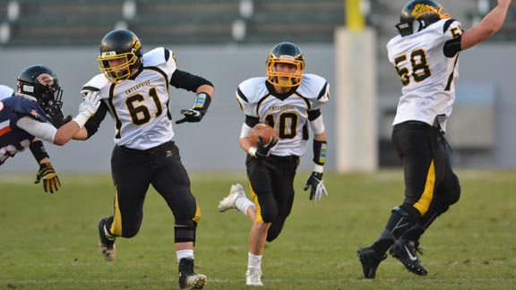 Enterprise's Justin Abney breaks into the clear during CIF D2 state bowl game behind the blocking of graduated players Bob Gillespie (left) and Skyler Ferguson. Photo: Scott Kurtz.