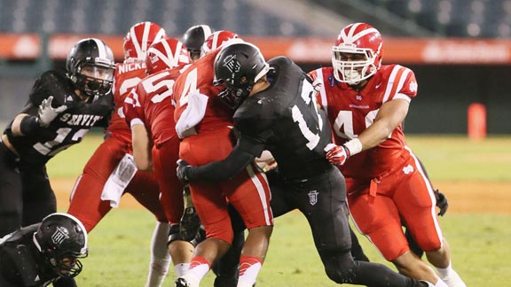 When Servite of Anaheim and Mater Dei of Santa Ana square off, there's often little room to run. Photo: Football page at ServiteHS.org. 